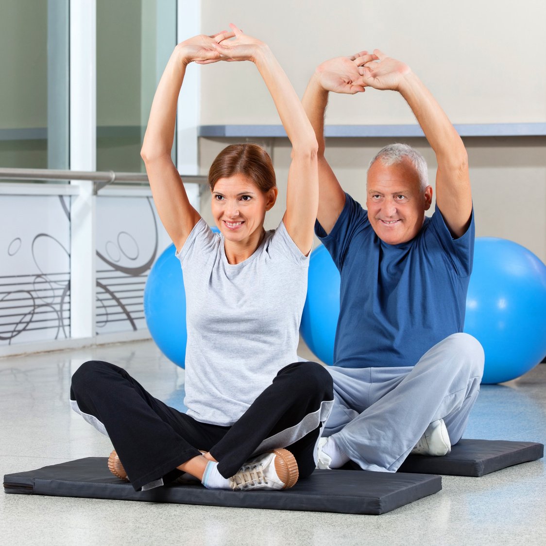 Fitness Group Stretching Their Muscles