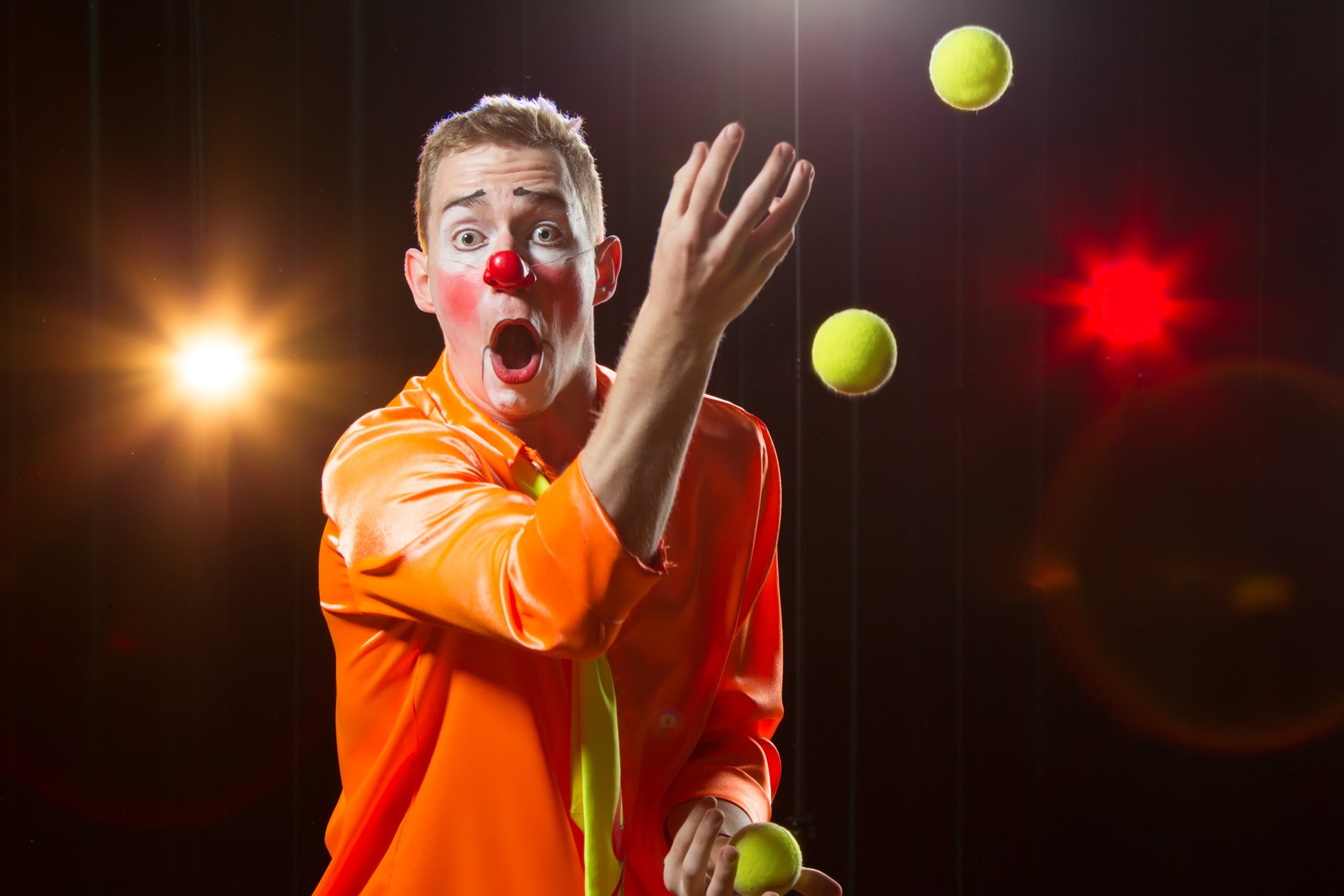 Circus Clown Performs Number. Clown Man Juggles